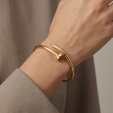 Elegant Nail Bracelet in Gold