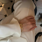 Elegant Nail Bracelet in Gold